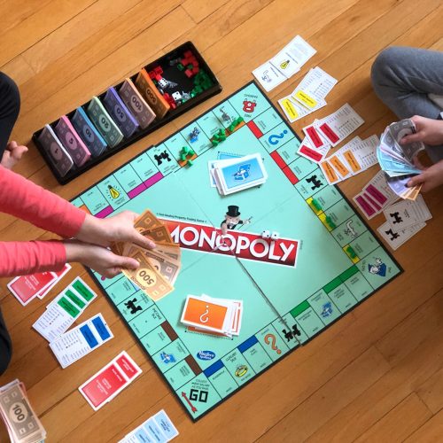 people playing the board game "Monopoly"