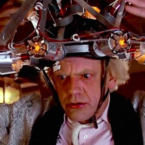 Doc Brown from Back to the Future with a mind reading contraption strapped on his head